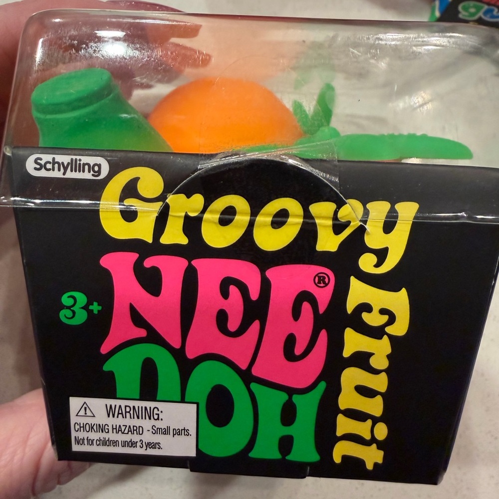 Schylling Groovy NeeDoh Orange Fruit Sensory Toy with Green Leaf